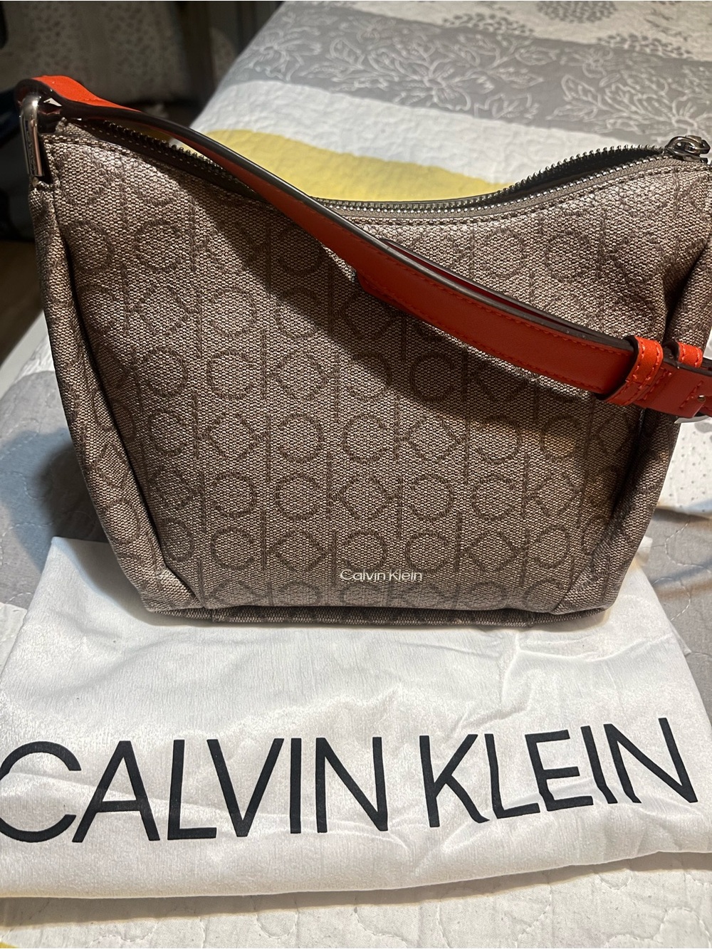 Calvin Klein Brown Monogram Shoulder Bag with Orange Strap Accent
